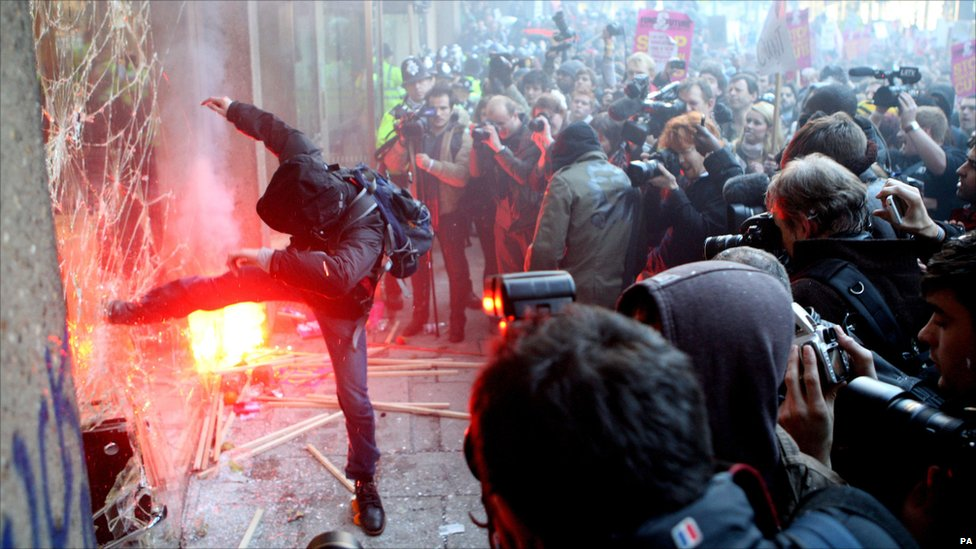 Window smashed during 2010 student protests in London. Image courtesy of BBC.